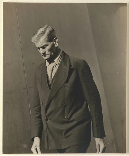 [Male Pedestrian in Double-Breasted Suit, Looking Down, Detroit (for Fortune Magazine Article "Labor Anonymous")]