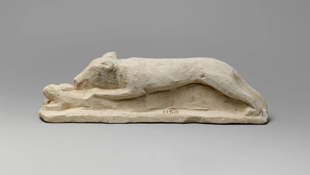 Limestone votive statuette of a hound seizing a hare — Unknown