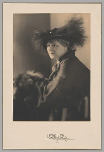 [Woman in Hat]