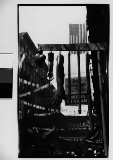 [Hanging Wax Votive Candle Display, Roosevelt Street, New York City]