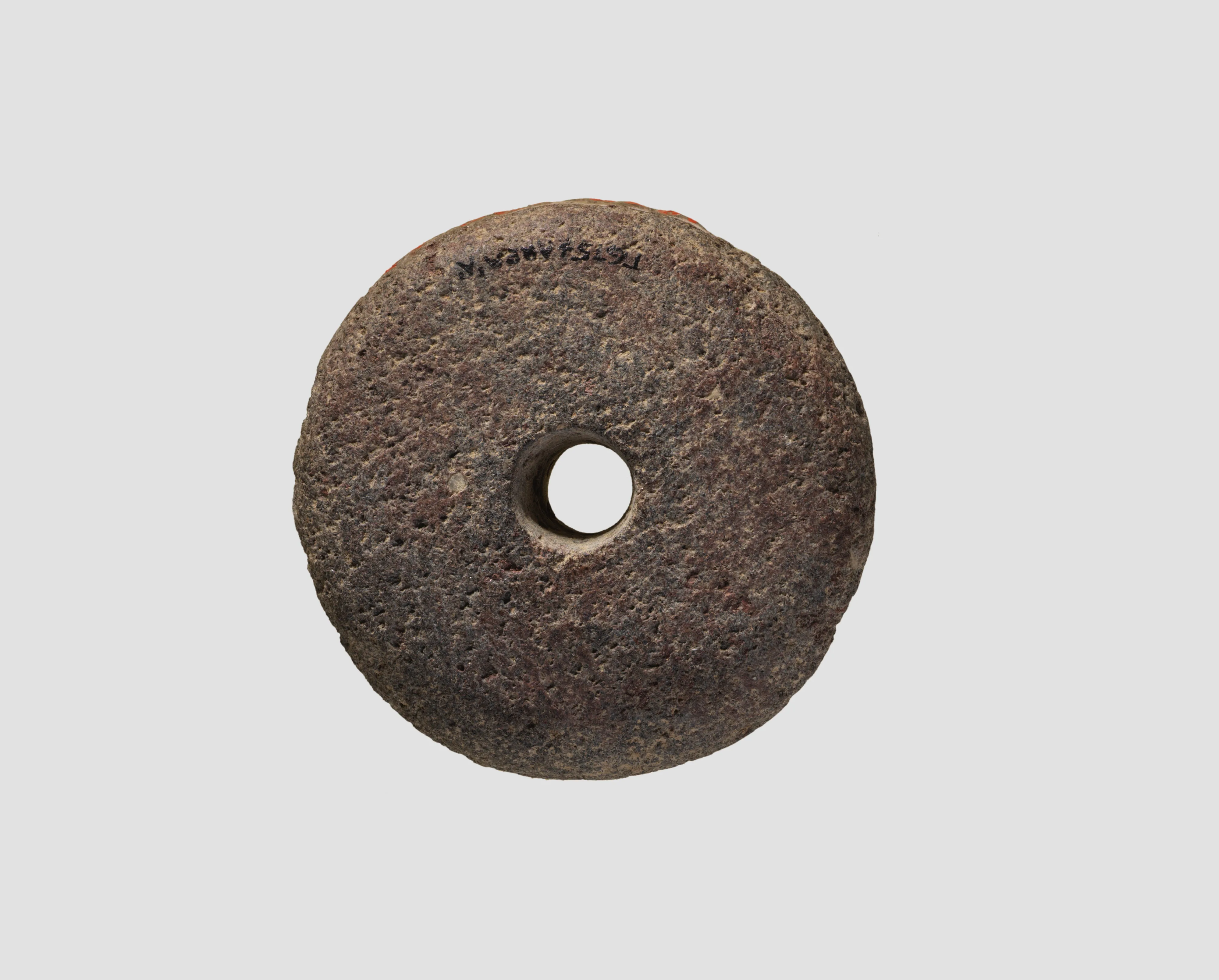 Spindle whorl (?) — Unknown