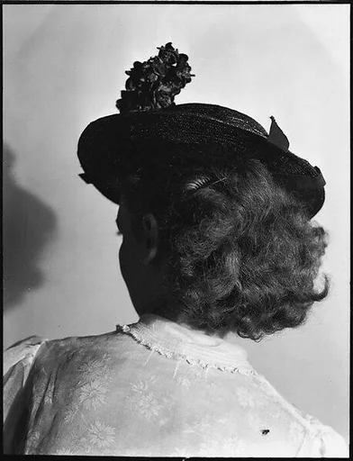 [Anne Harvey Wearing Hat, From Behind]