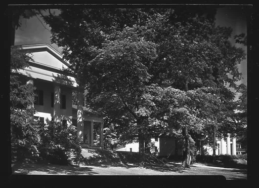 [Greek Revival House Behind Trees and Shrubs, Greenfield, Massachusetts]