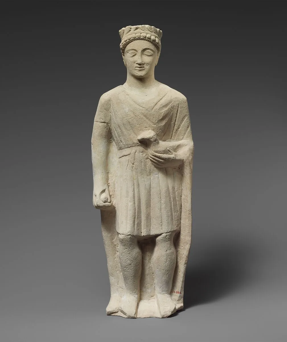 Limestone statuette of a beardless male votary holding a bird — Unknown