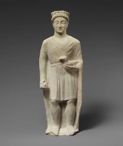 Limestone statuette of a beardless male votary holding a bird