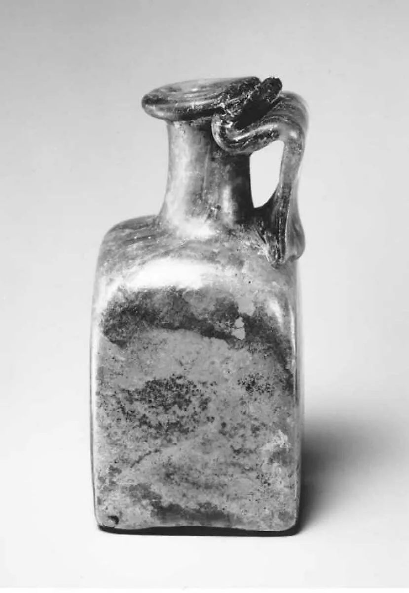Glass square bottle with base inscription — Unknown