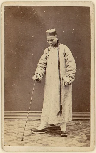 [Man with Long Braid]