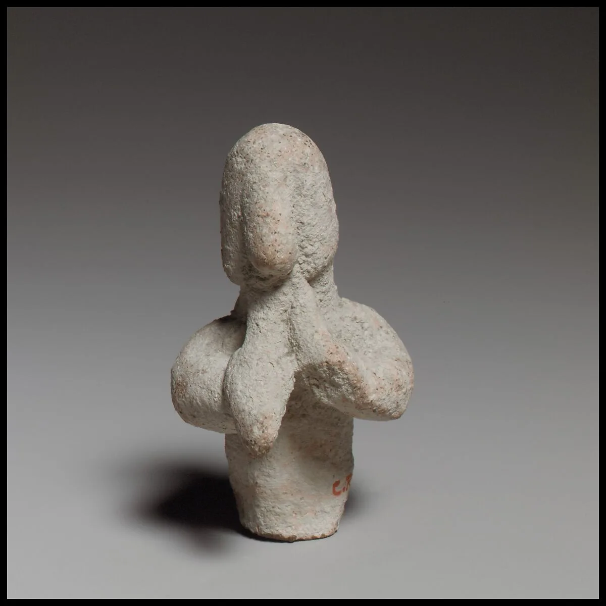 Statuette of a votary playing flute — Unknown