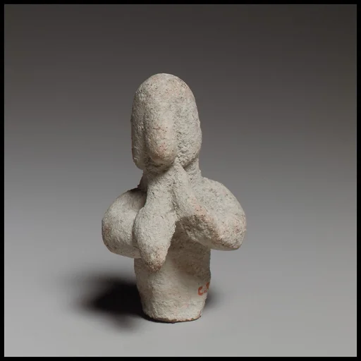 Statuette of a votary playing flute