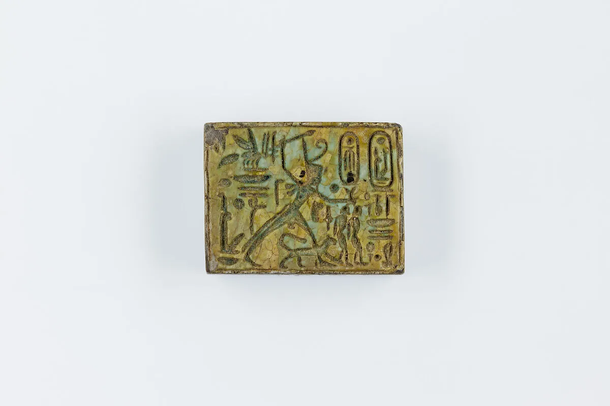 Oblong Plaque Depicting Ramesses II Smiting Enemies, opposite side relief scene of Isis and Nephthys flanking falcon labeled Horus son of Isis — Unknown