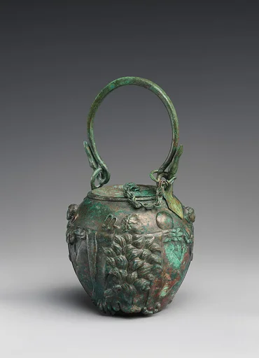 Bronze balsamarium decorated with lion-skins and herms