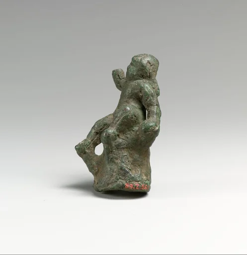 Bronze statuette of Eros seated on a rock