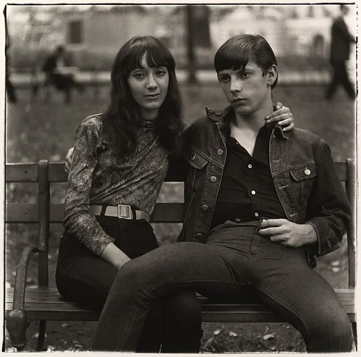 Young couple on a bench in Washington Square Park, N.Y.C.