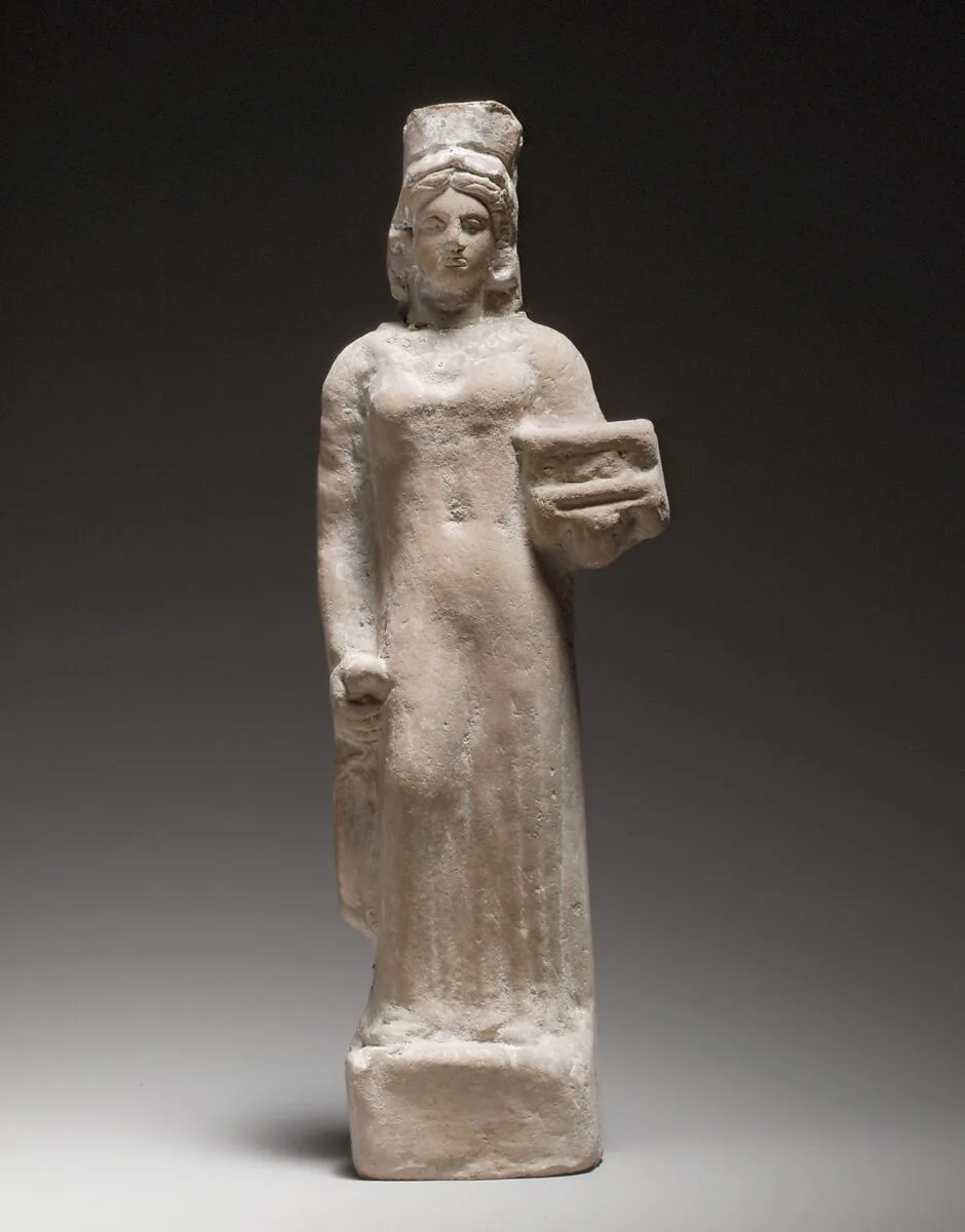 Terracotta figurine of a standing female votary holding a box — Unknown