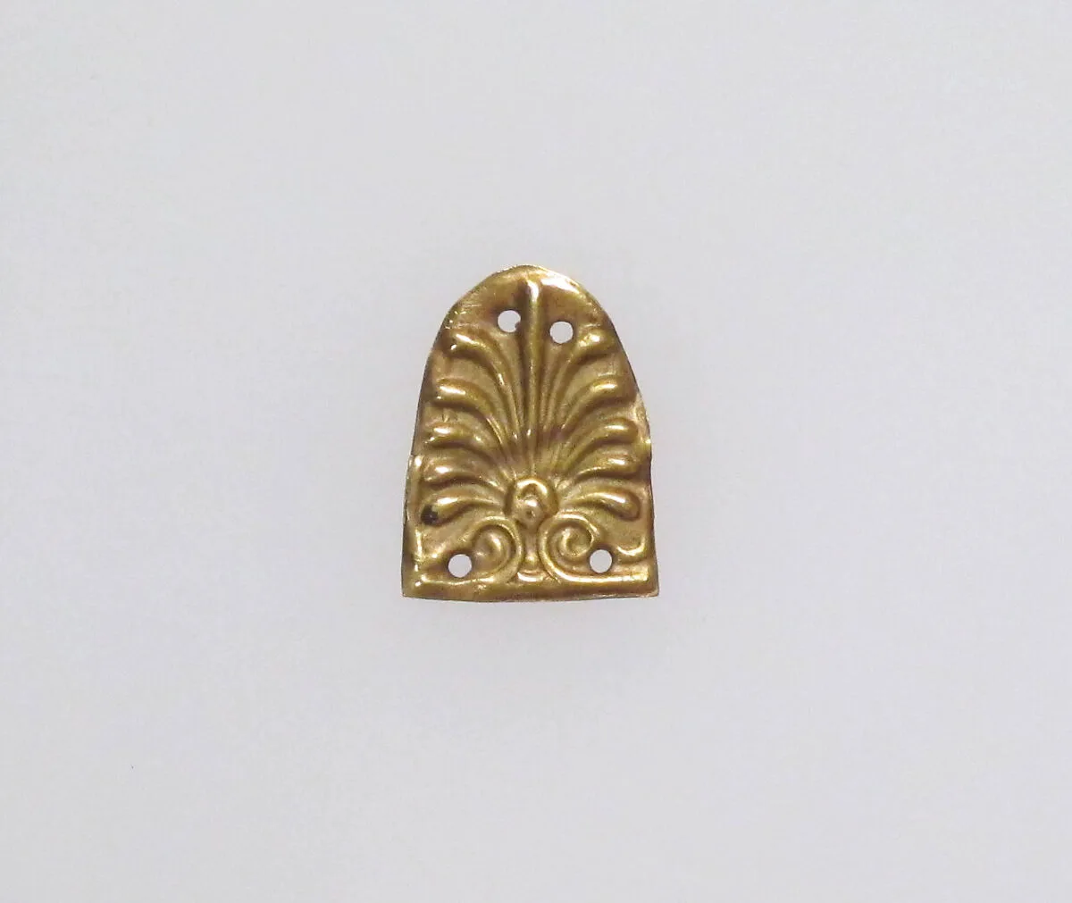 Dress ornament decorated with a palmette — Unknown