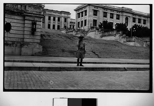 [Officer in Front of University of Havana]