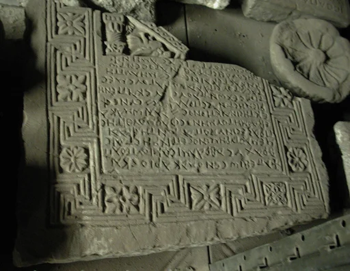 Fragment of an Inscribed Stele Enclosed in a Frame with Swastikas and Rosettes; Part of a Gable with Bird and a Pilaster.