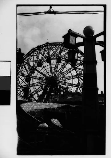 ["Wonder Wheel" and "Virginia Reel" Rides with Hanging Lamps and Cables, Coney Island, New York]