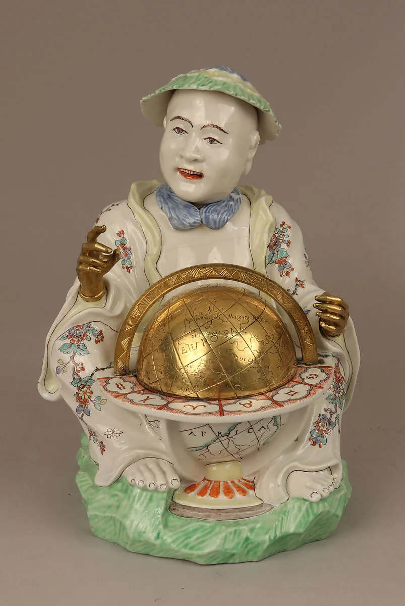 Pair of seated figures with globes — Chantilly