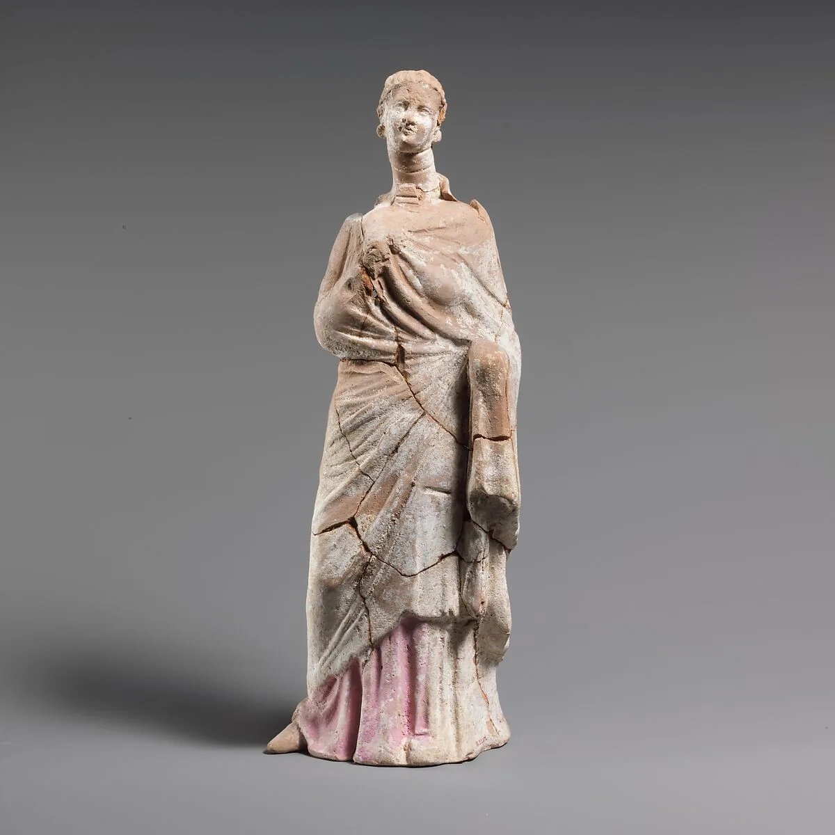 Terracotta statuette of a woman — Unknown
