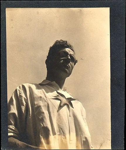 [Paul Grotz, Wearing Monocle and Maple Leaf on Chest (From Below), Probably Canada]