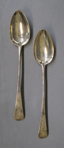 Two gravy spoons