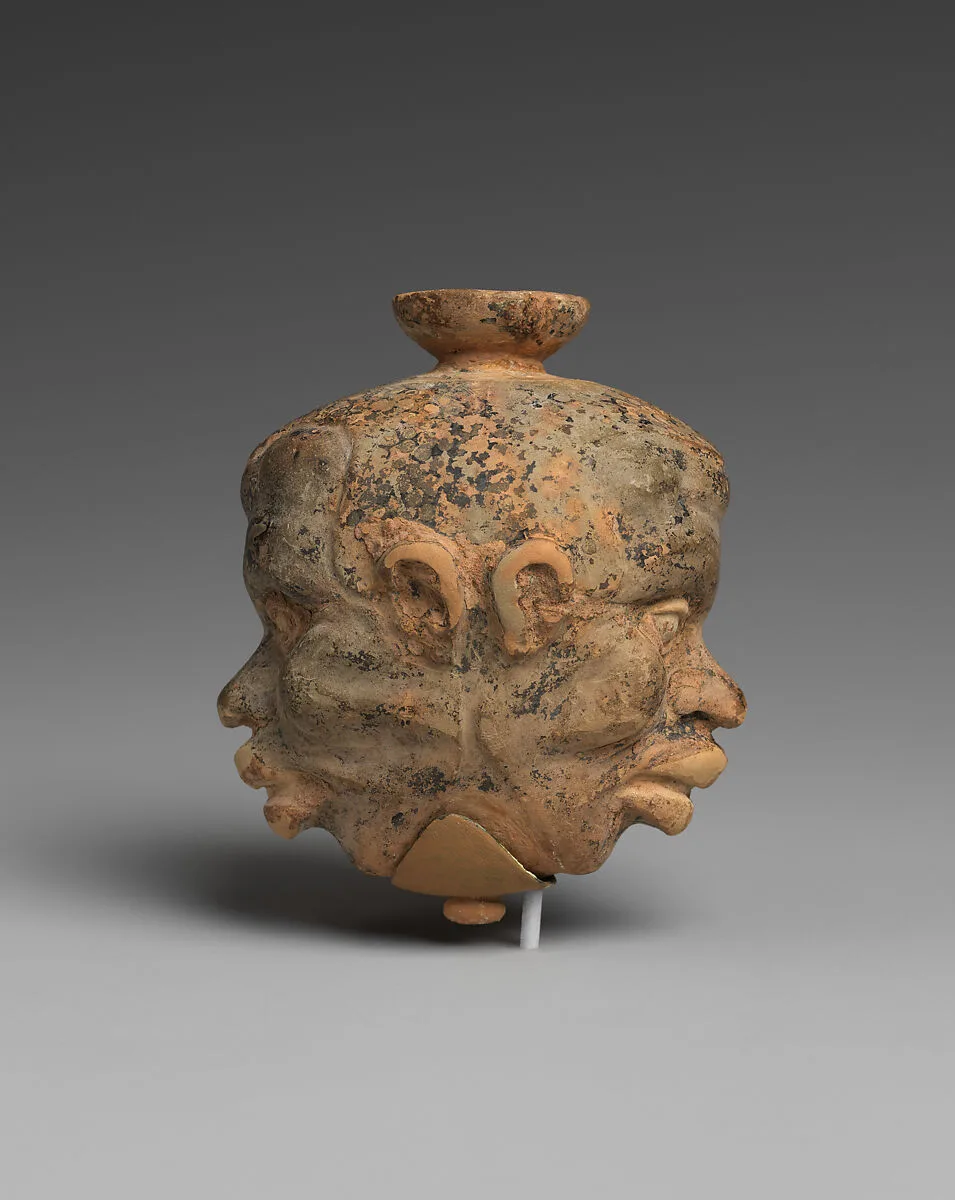 Terracotta aryballos (oil flask) in the form of two Black African heads — Unknown