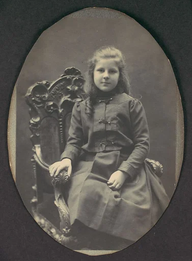 [Girl with Ringlets, Seated, Three-Quarter Length]
