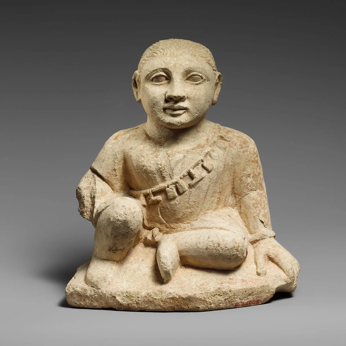 Limestone statuette of a temple boy — Unknown