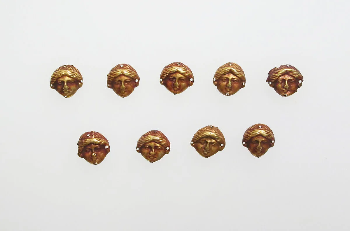 Bead ornaments in the form of female head — Unknown