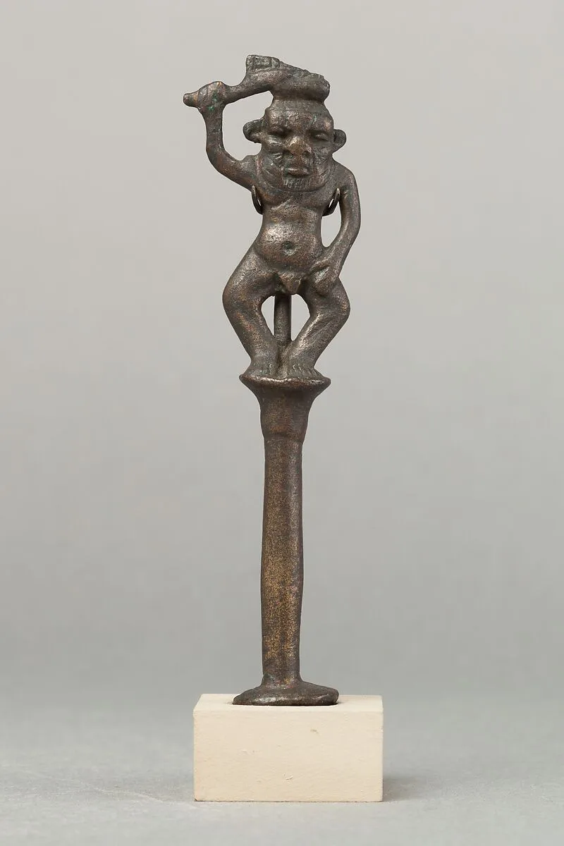 Bes on a column holding a knife — Unknown
