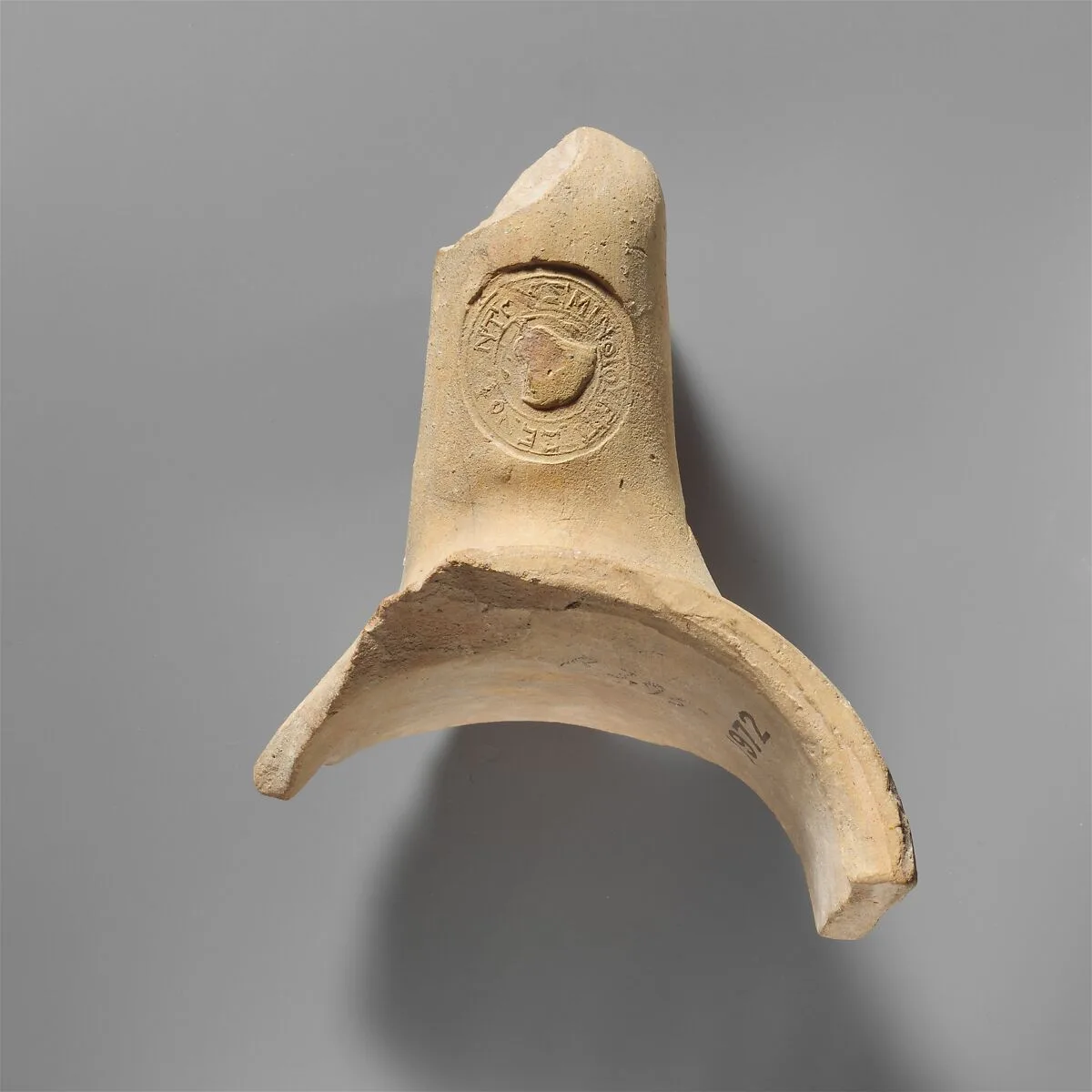 Terracotta amphora fragment with stamped handle — Unknown