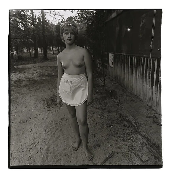 A young waitress at a nudist camp, N.J. — Diane Arbus
