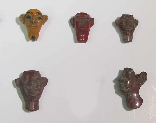 Inlays from shrine: heads