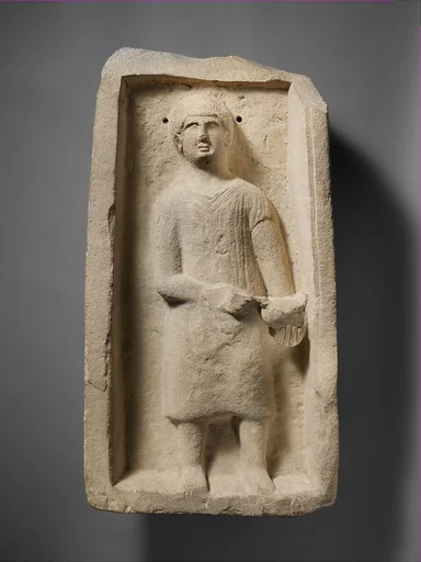 Limestone funerary stele of a boy