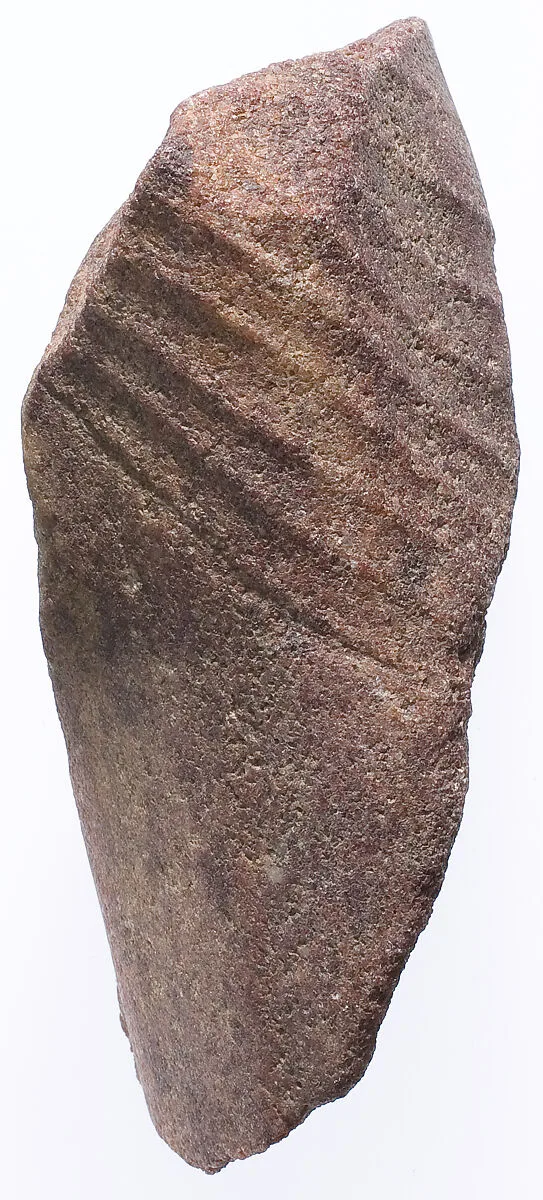Section of the left leg from a small striding statue — Unknown