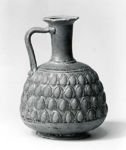 Vessel decorated with four rows of pine cones