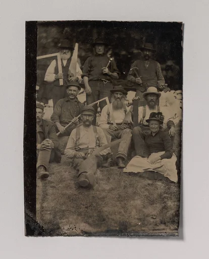 [A Woman and Eight Carpenters Posed Outdoors]