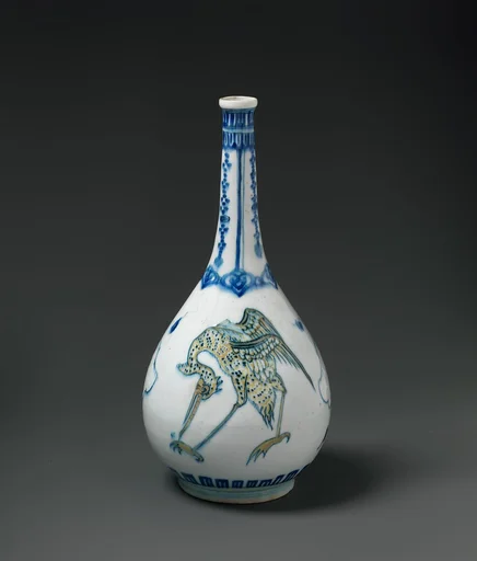 Bottle Depicting Storks in Blue and Yellow on a White Background