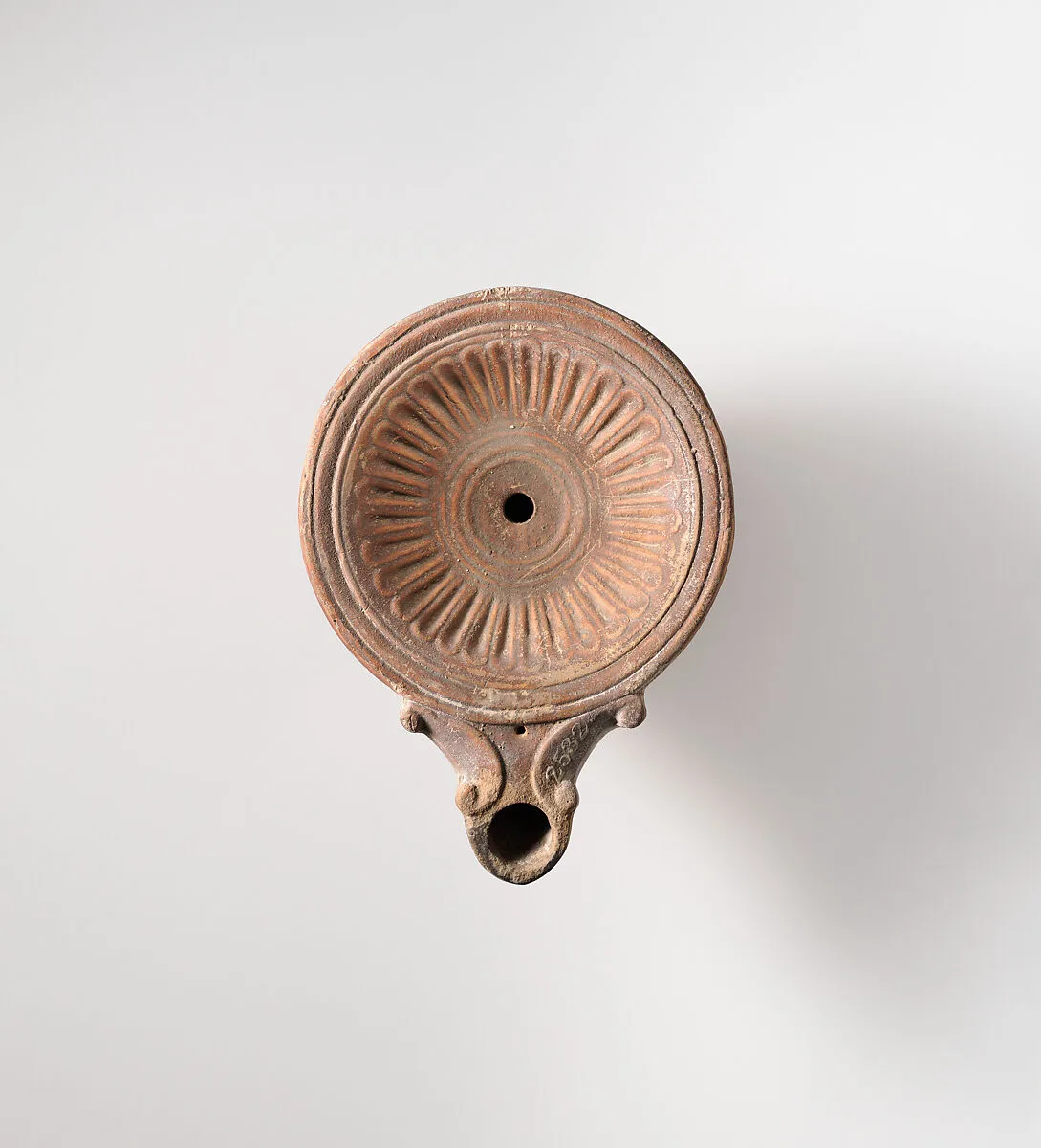 Terracotta oil lamp — Unknown