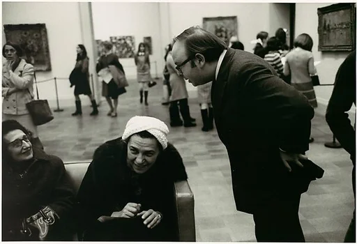 [Henry Geldzhaler Addressing Two Museum-Goers]