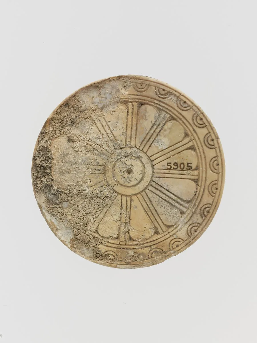 Ivory disk with rosette — Unknown