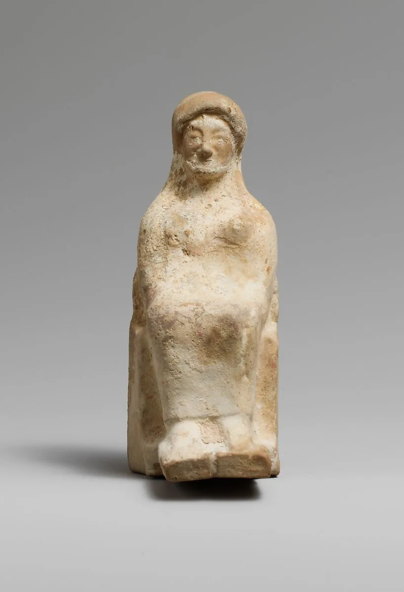 Terracotta statuette of a seated woman — Unknown