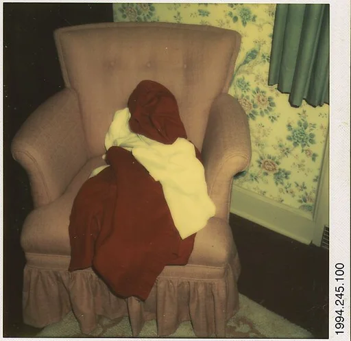 [Clothes Draped on Armchair]