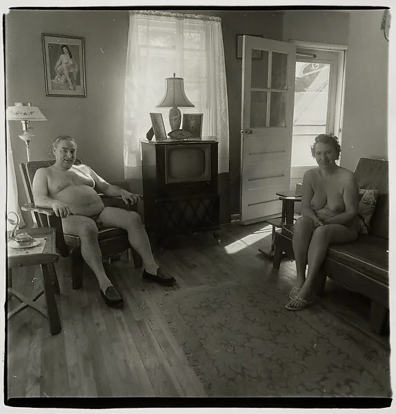 Retired man and his wife at home in a nudist camp one morning, N.J. — Diane Arbus
