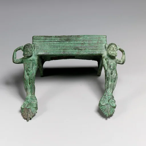 Pair of bronze handles with satyrs