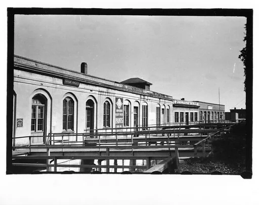 [Warehouse Waterfront Buildings and Footbridges, Through Trees, Savannah, Georgia]