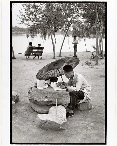 A Professor Corrects His Class Papers by the Lake in the Newly Build King Chan Park, Peking