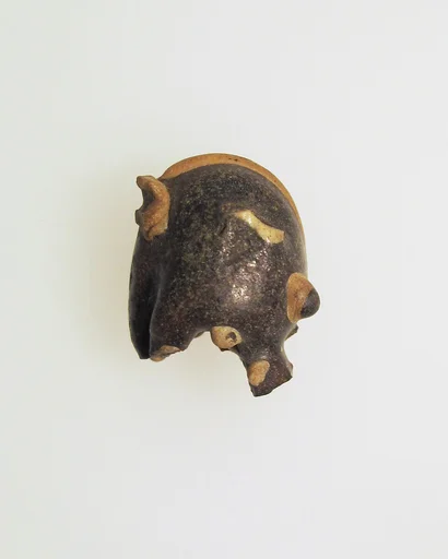 Glass pendant in the form of a demonic mask