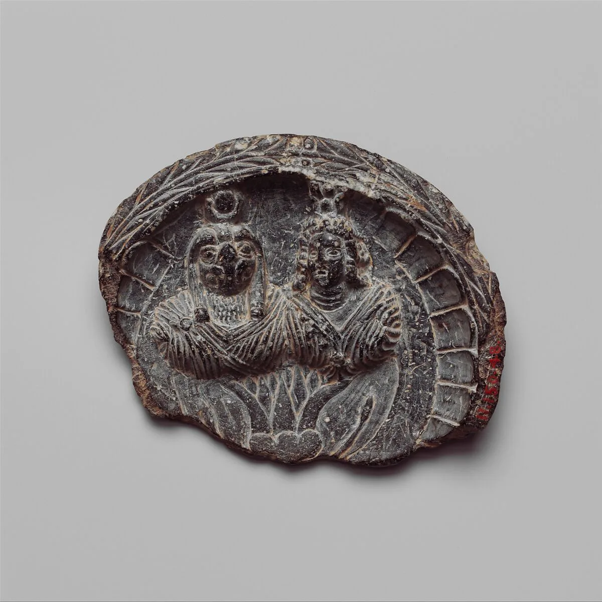 Shallow dish with high relief figures of Isis and falcon-headed Horus — Unknown